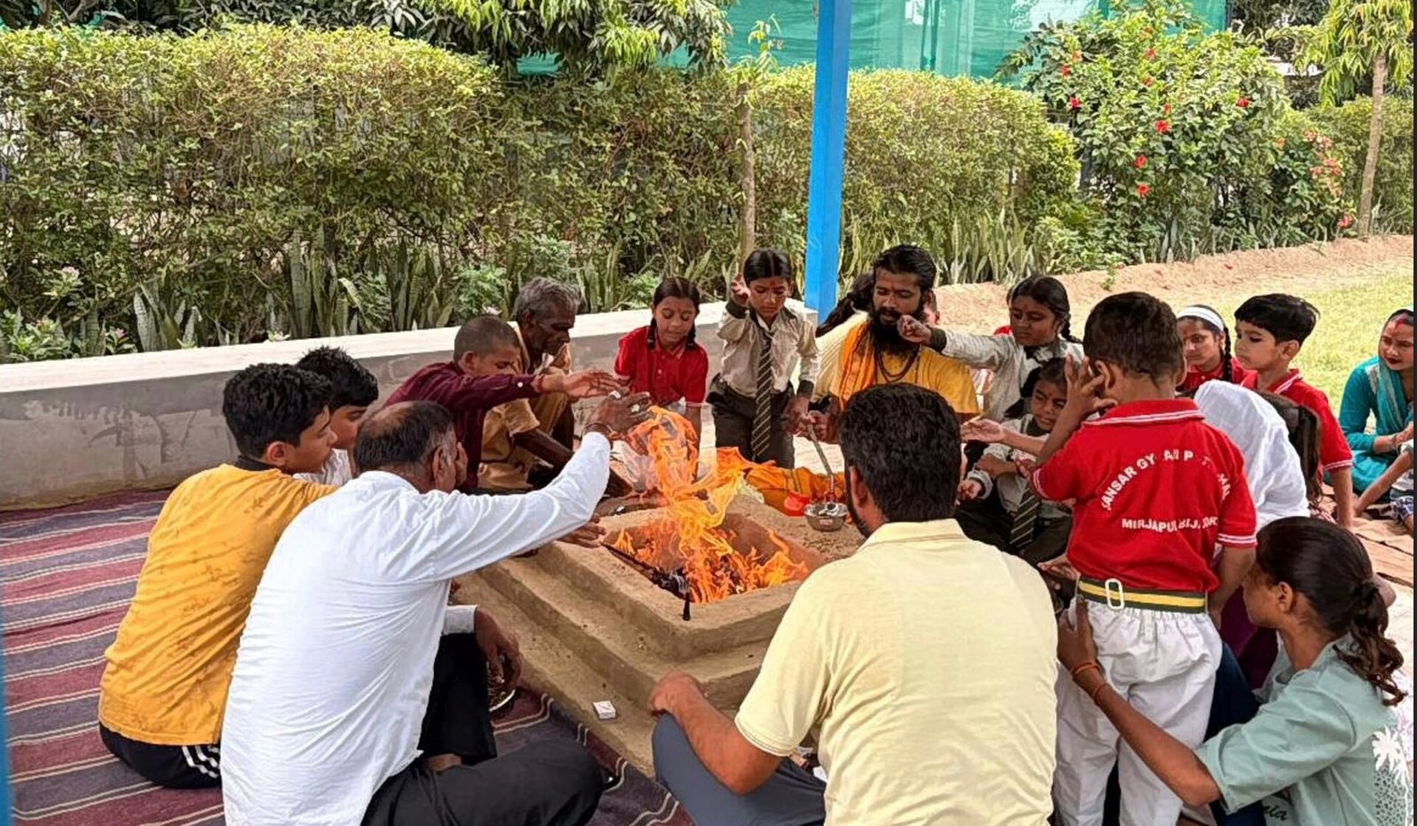 The Yajna fire lit as students and staff take part in the ceremony