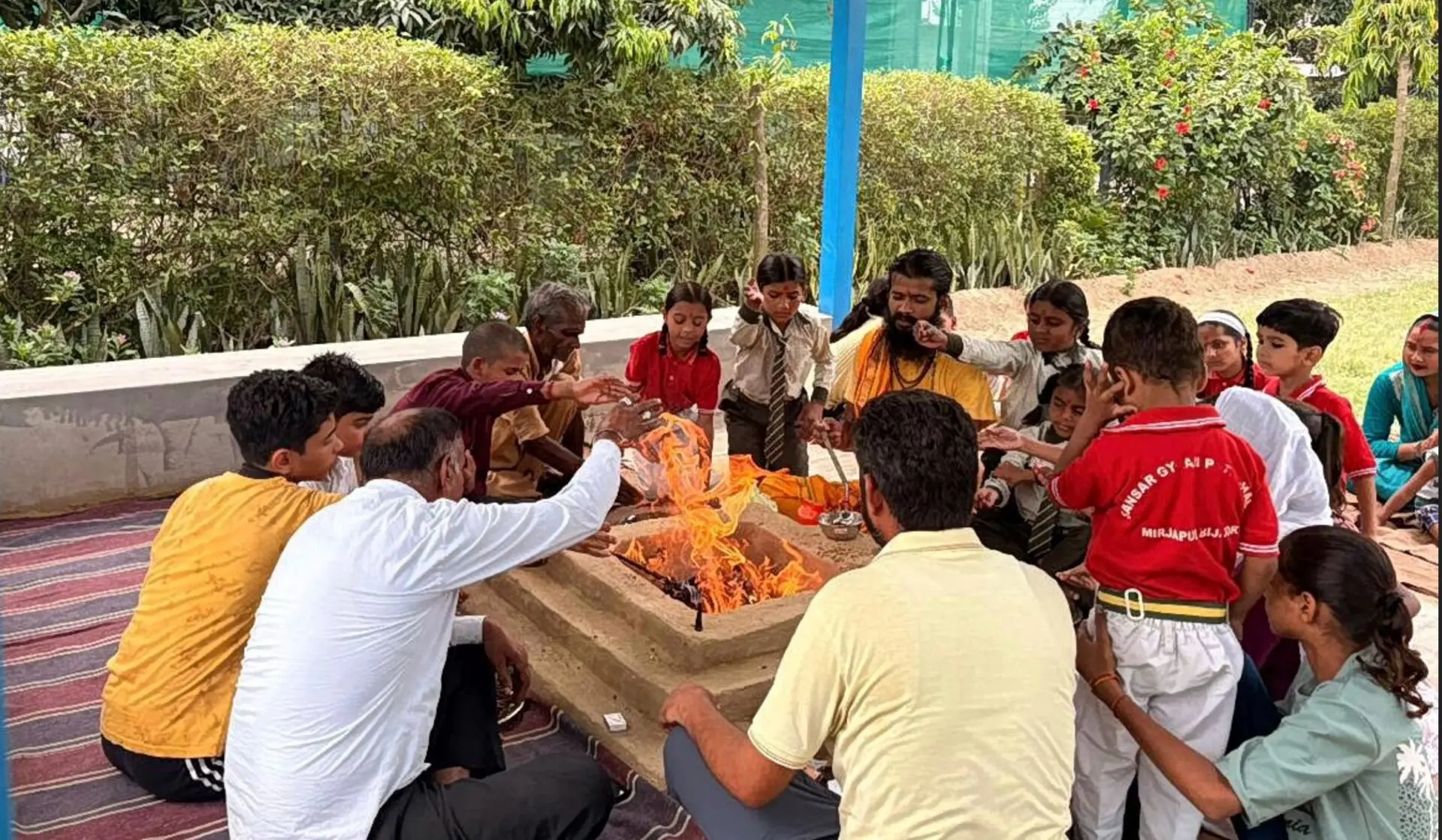 The Yajna fire lit as students and staff take part in the ceremony
